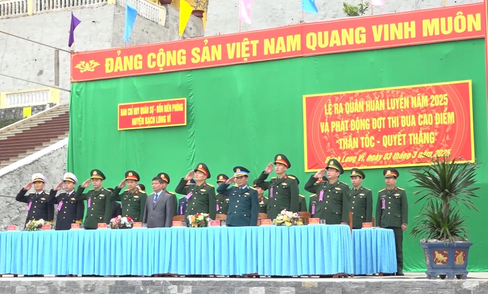 A group of people in uniform saluting
Description automatically generated